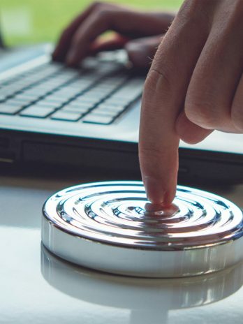 person holding clear glass round lid